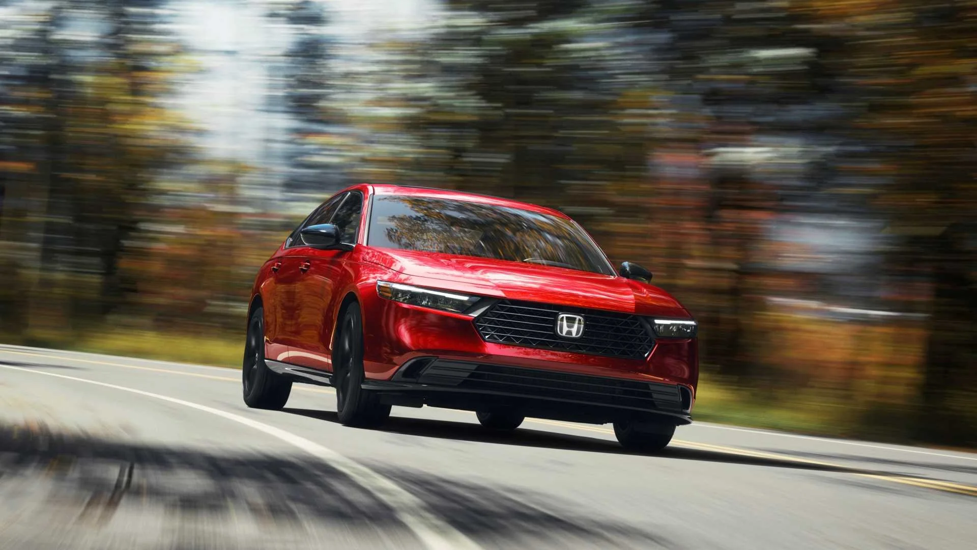 Front 3/4 action shot of a 2023 Honda Accord 