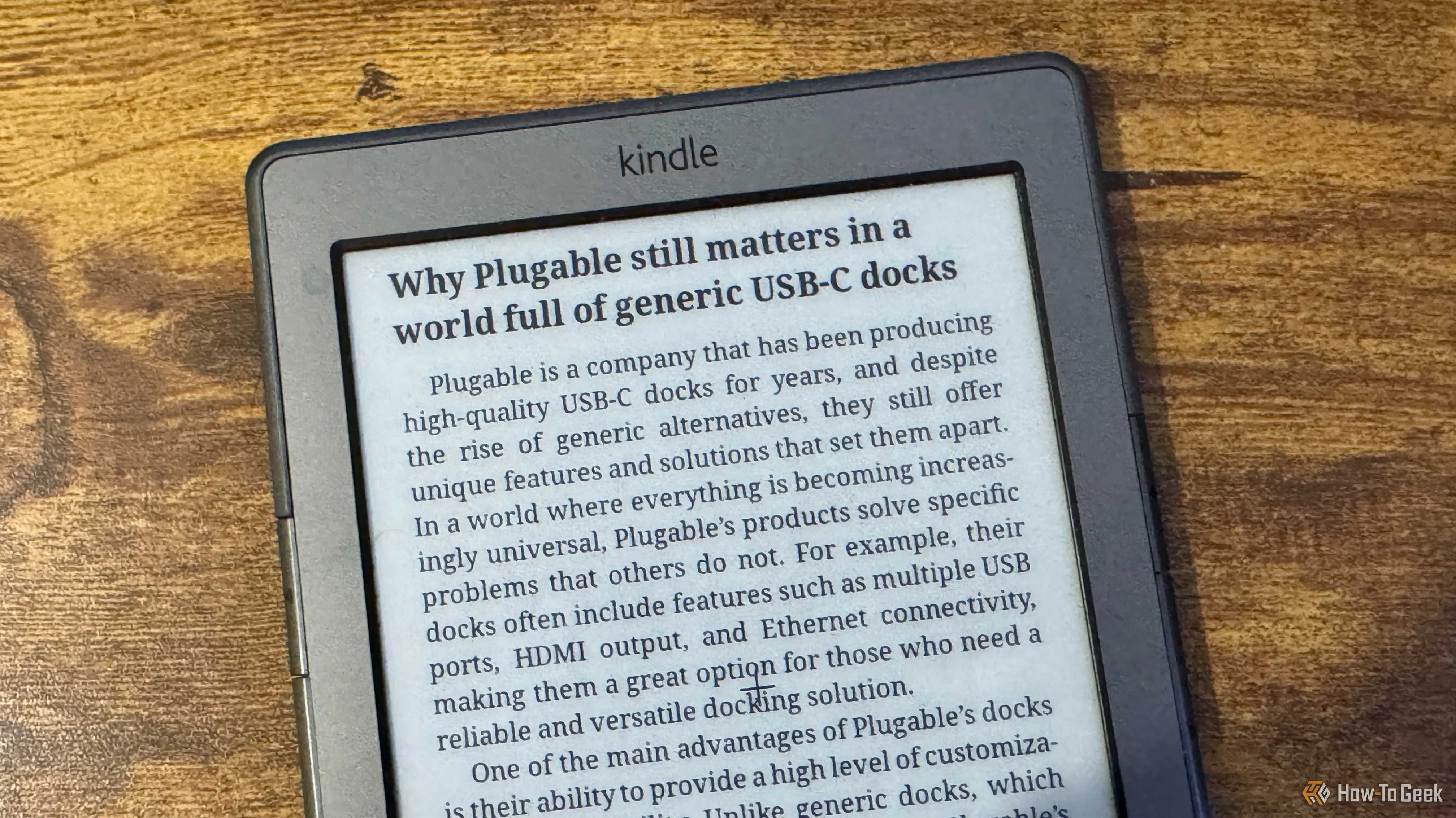 A close up of a Kindle 4 showing the Why Plugable Still Matters article title and opening paragraph about USBC docks.