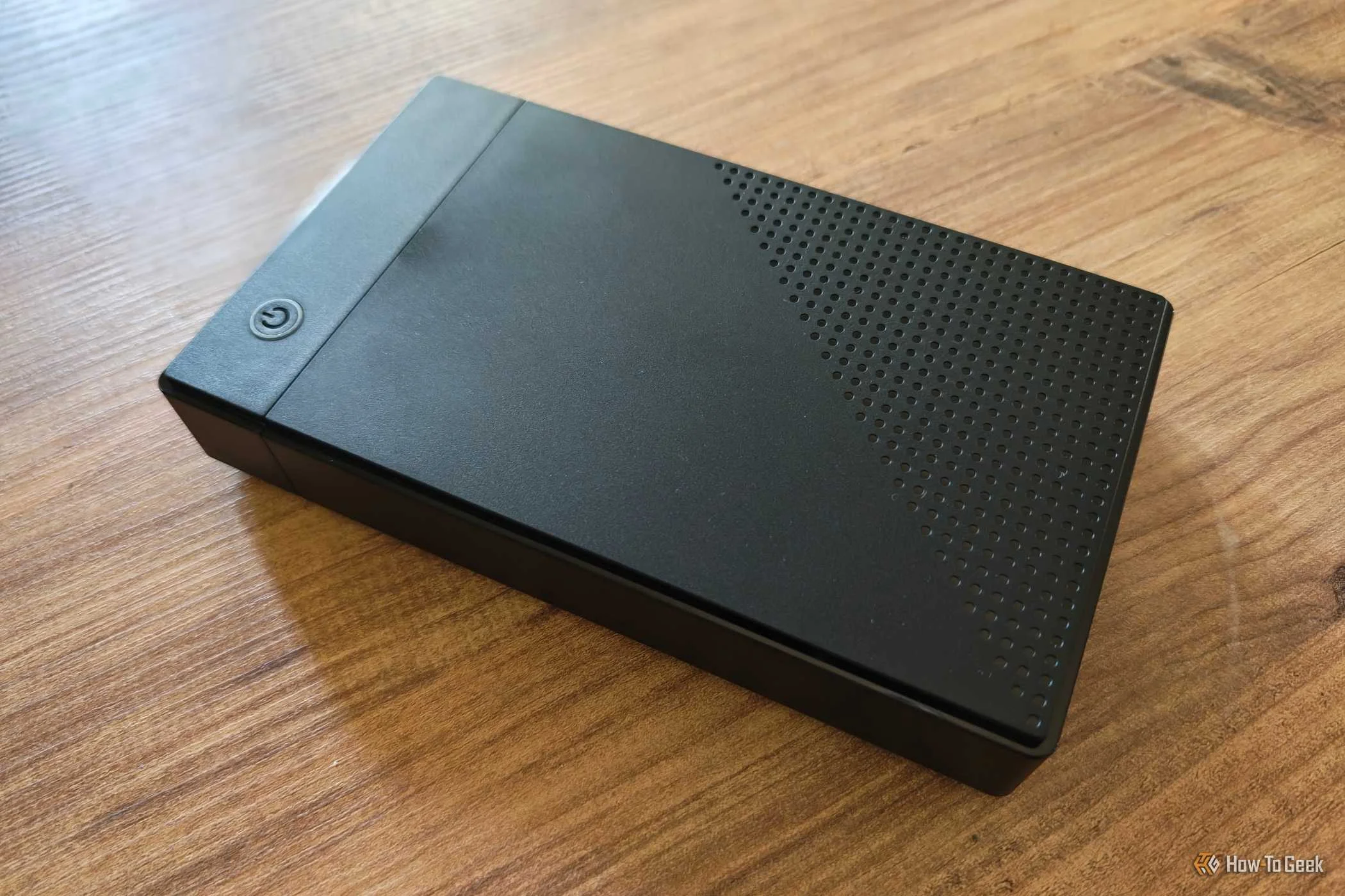 Hard disk drive enclosure on top of a side table. 
