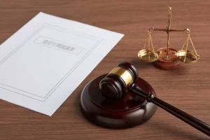 Court gavel, scales of justice and legal documents illustrating the CFTC insider trading lawsuit against US Army soldier Gannon Ken Van Dyke over alleged Polymarket prediction market trades.