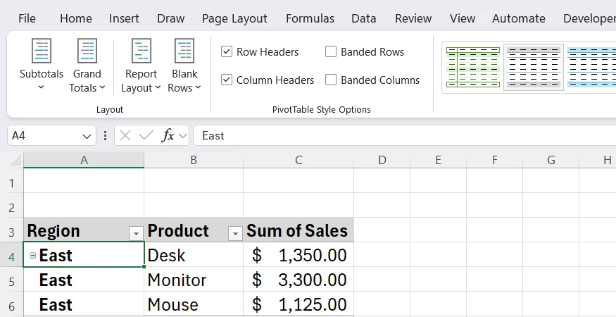 An Excel PivotTable is colored gray, after a non-default style is selected in the PivotTable Styles group of the contextual Design tab.