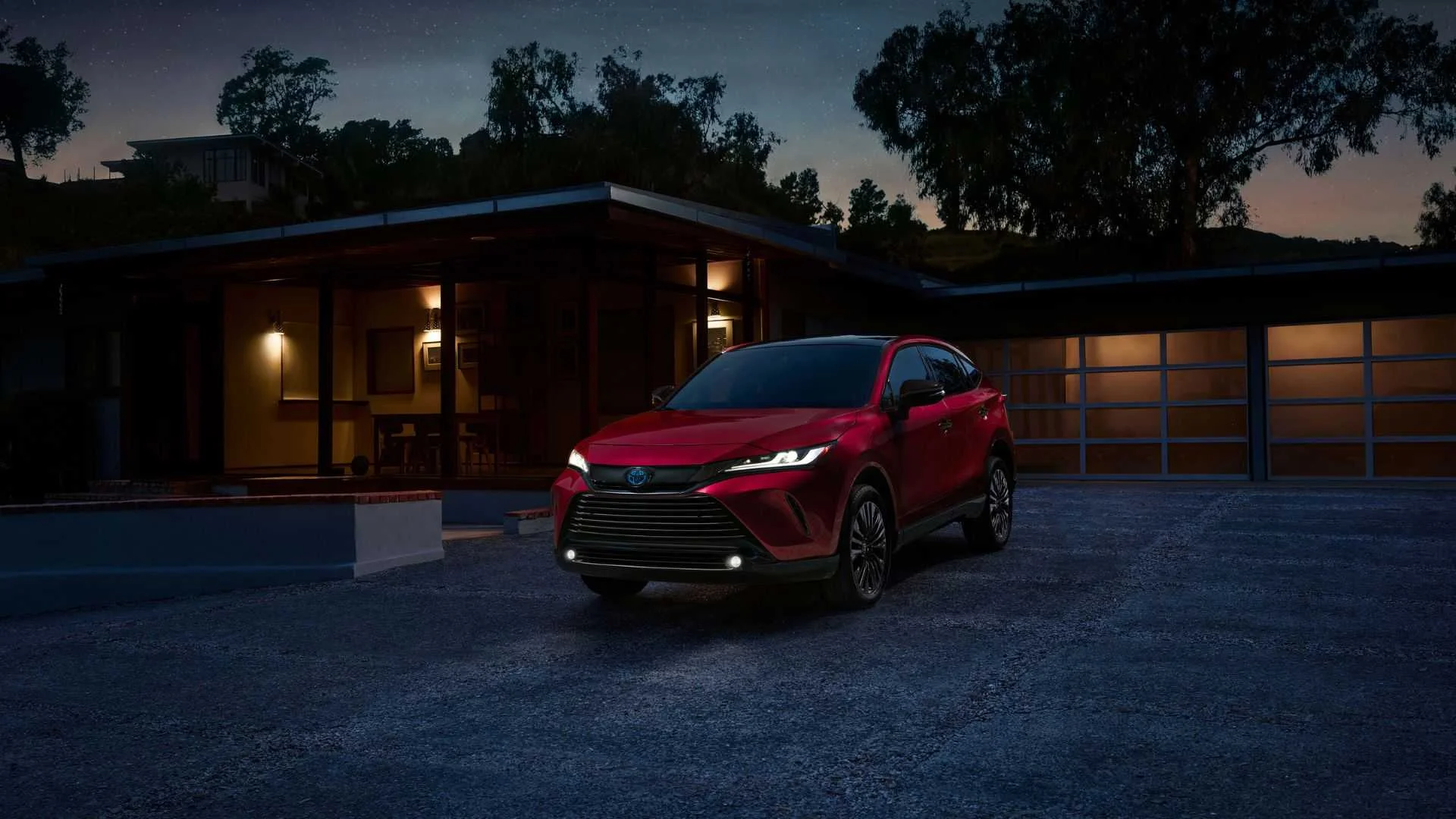 Static front 3/4 shot of a red 2024 Toyota Venza Nightshade.