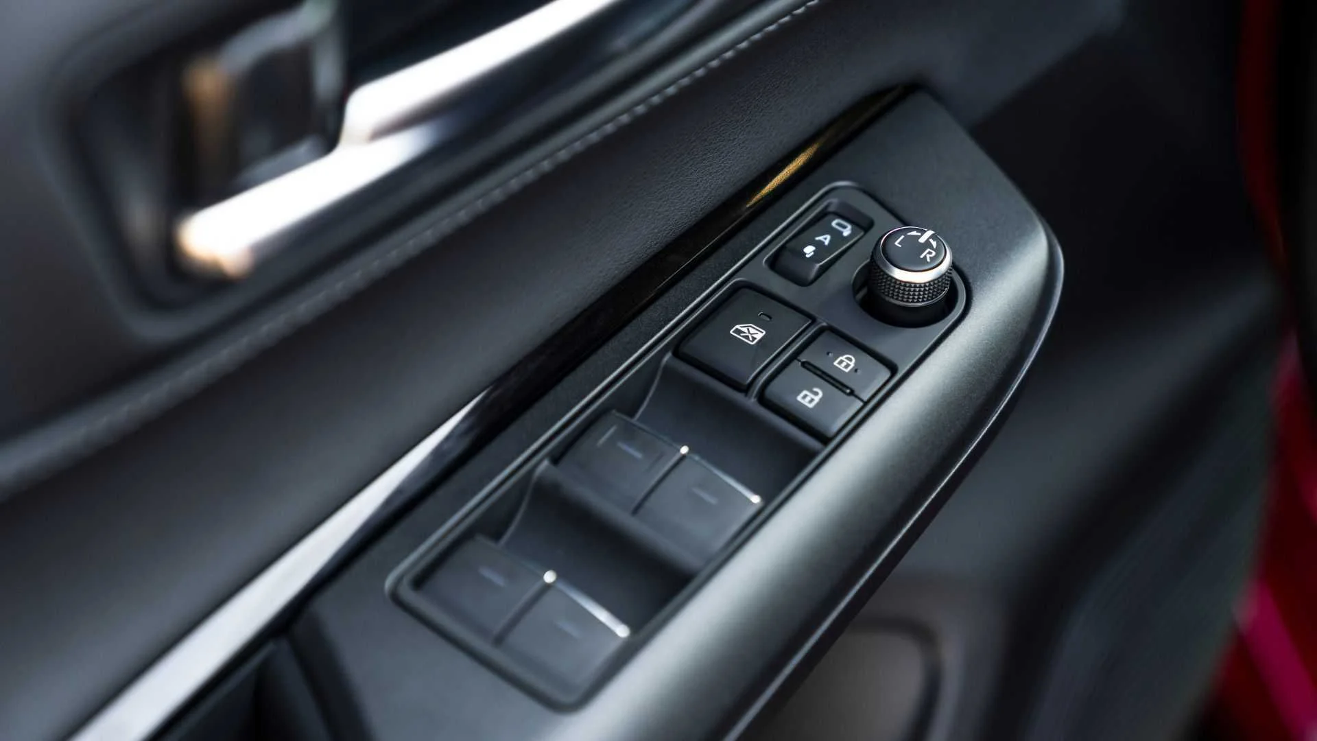 Close-up shot of the window switches in a 2022 Toyota Venza.