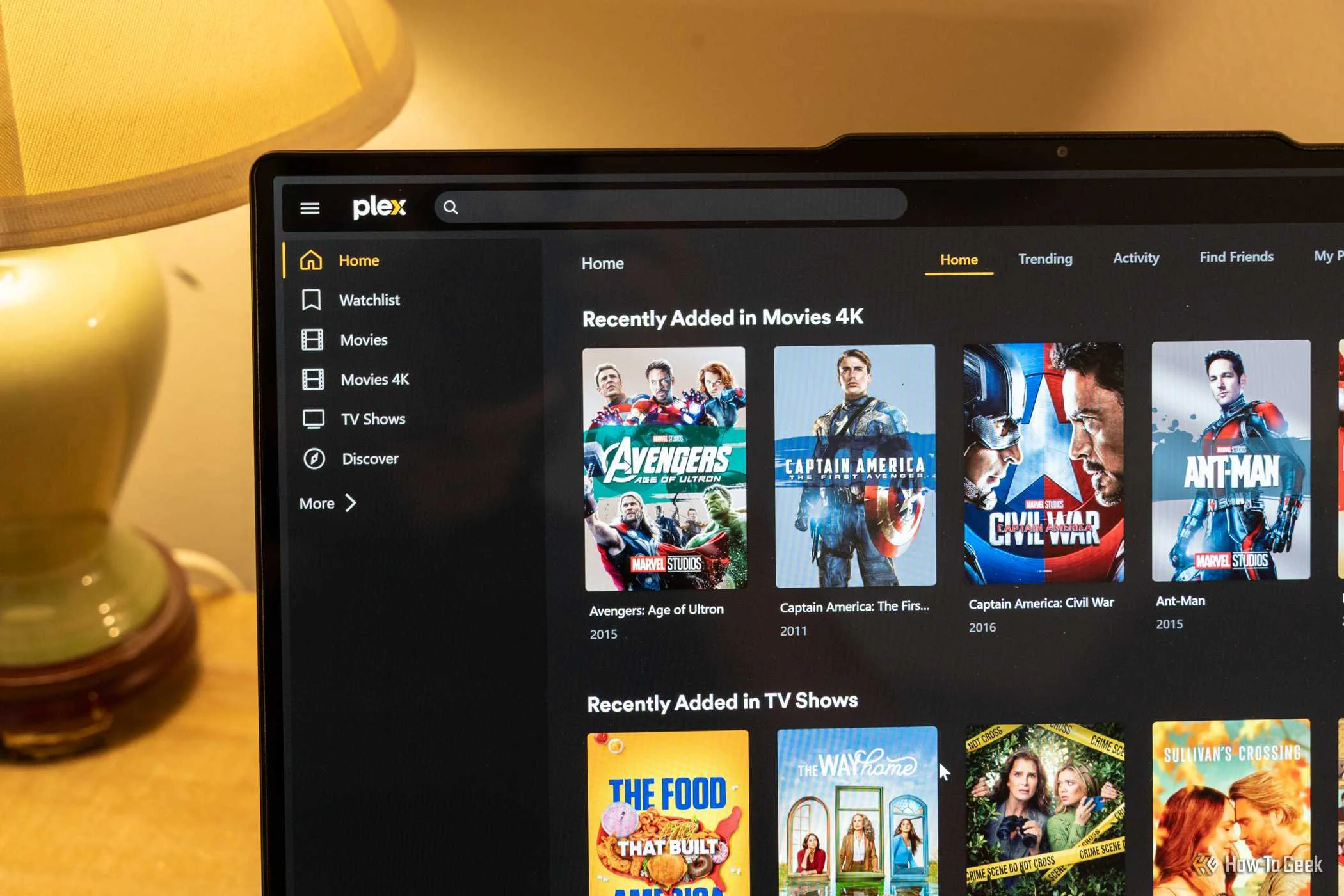 The Plex homepage open showing Marvel movies in 4K and other movies on a laptop screen.