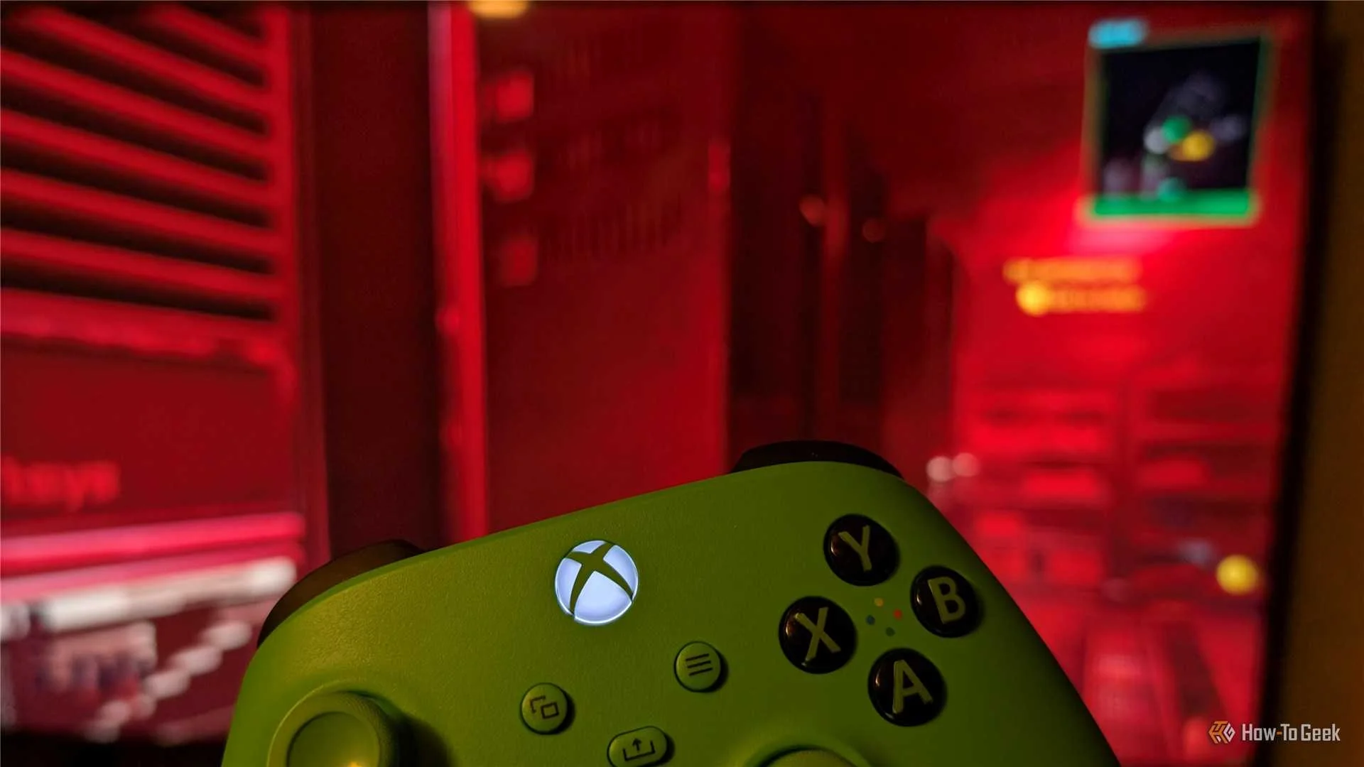 An Xbox controller in front of Cyberpunk 2077.