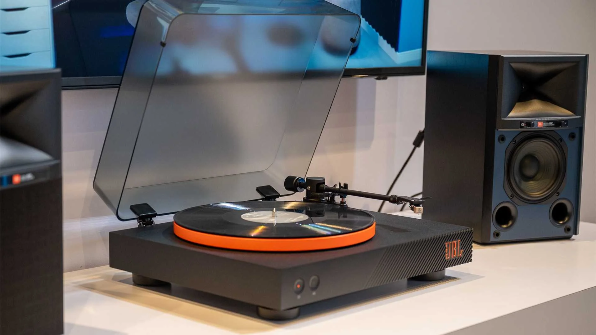 A vinyl record player with speakers.