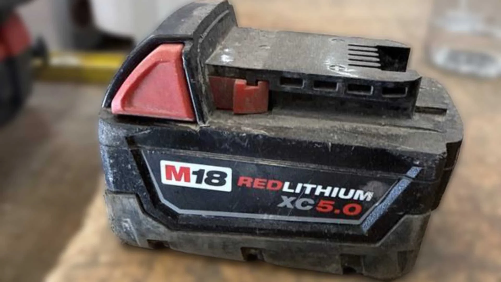 Milwaukee M18 battery on a table