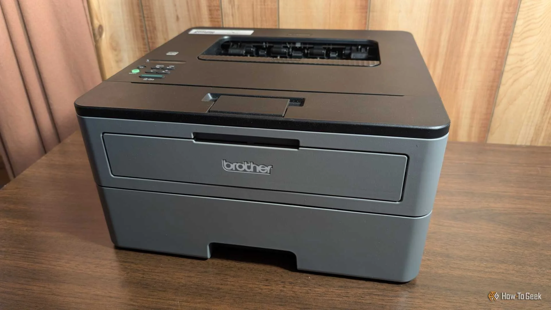 A black and grey Brother laser printer. 