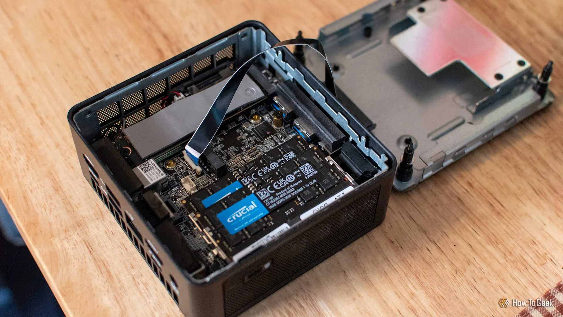 The Geekom IT15 opened to reveal its motherboard.