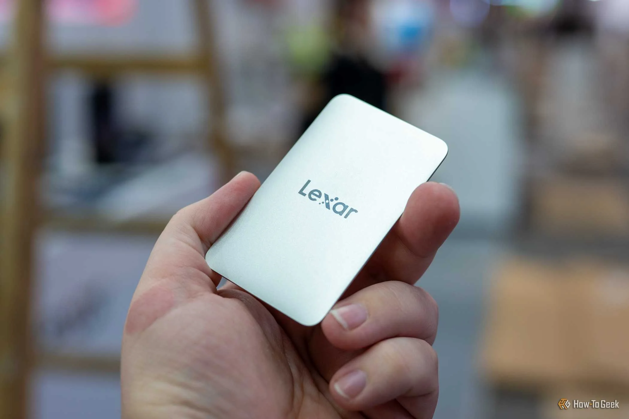 Person holding the Lexar Muse SSD at IFA 2026.