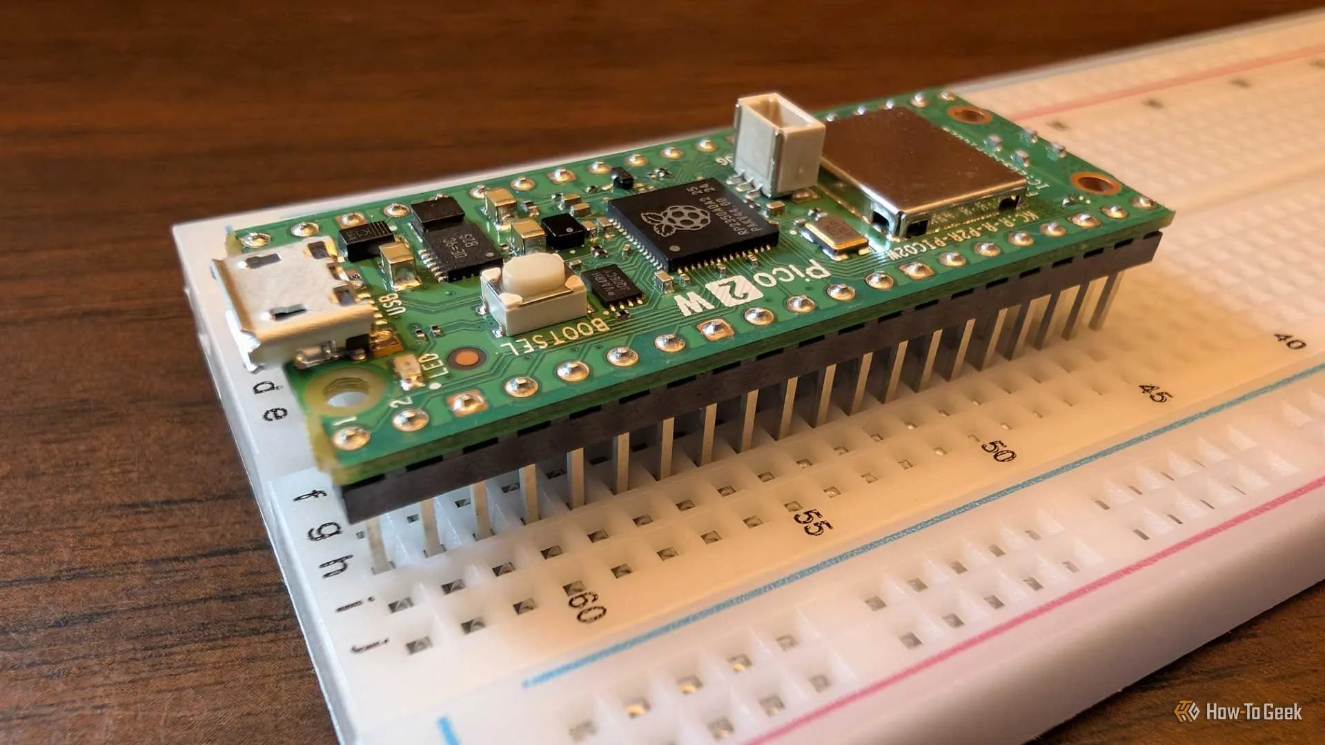 The Pico 2 W sitting on a breadboard.