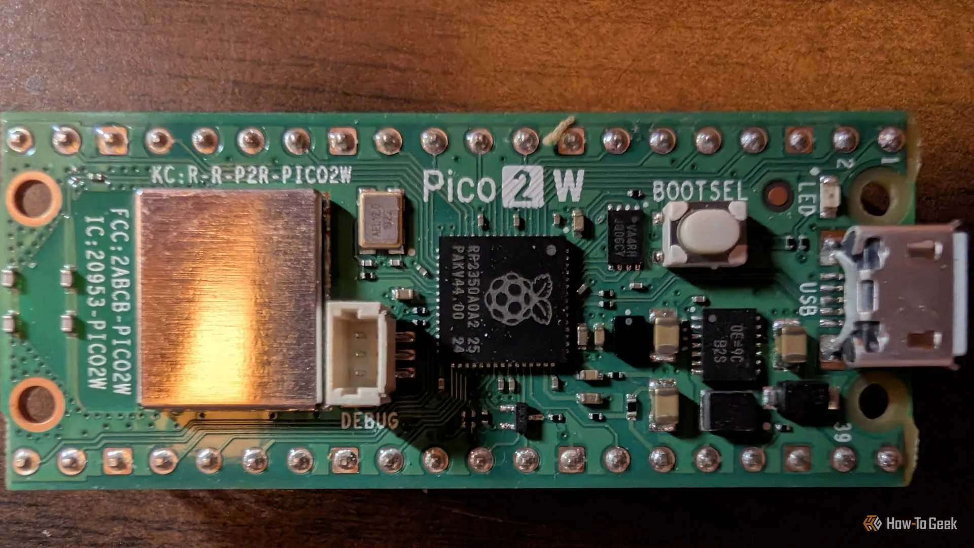 Top-down shot of a Pico 2 W with GPIO header.