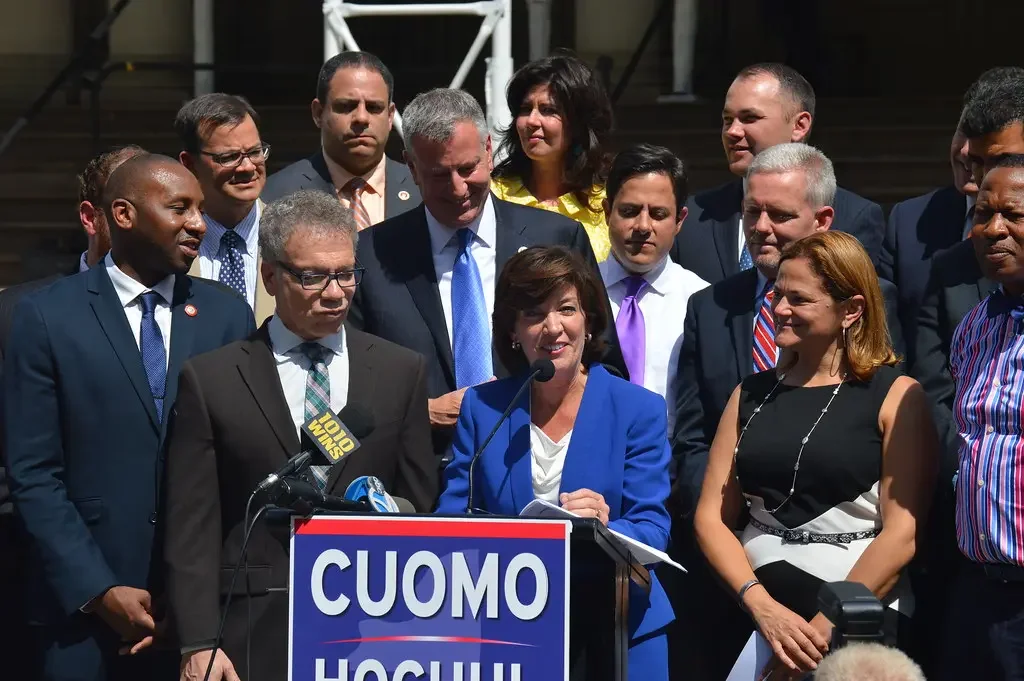 New York Governor Kathy Hochul speaking at a podium during a public event.