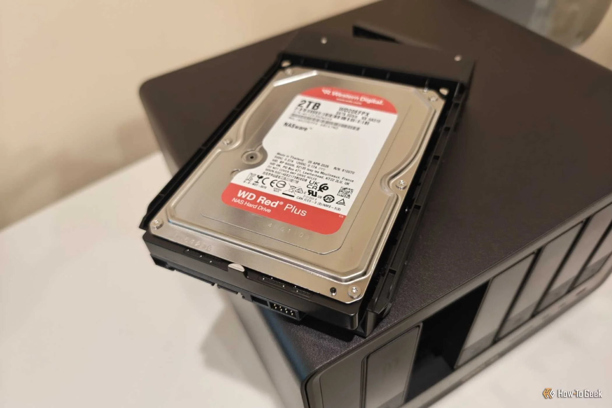 Hard drive on top of a UGREEN DXP6800 Ultra.