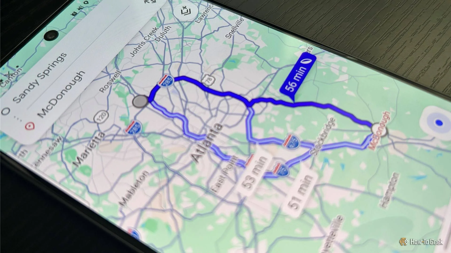 Google Maps navigation showing multiple routes from Sandy Springs to McDonough, Georgia.