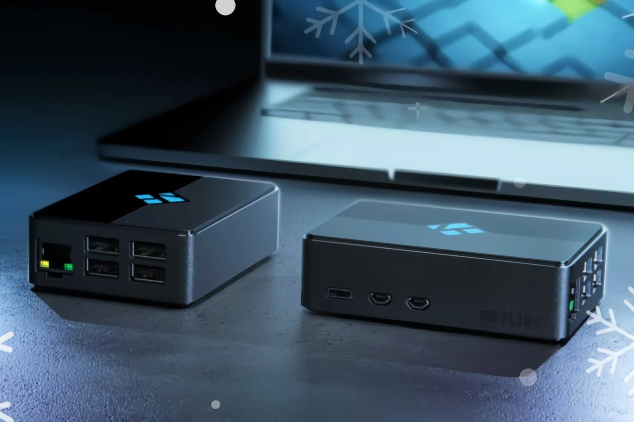 Kodi Limited Edition Raspberry Pi Case next to each other near a laptop.